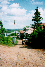 Sutyrin St. in Kadnitsy. A river on the back is Kud'ma river, one of the Three.
